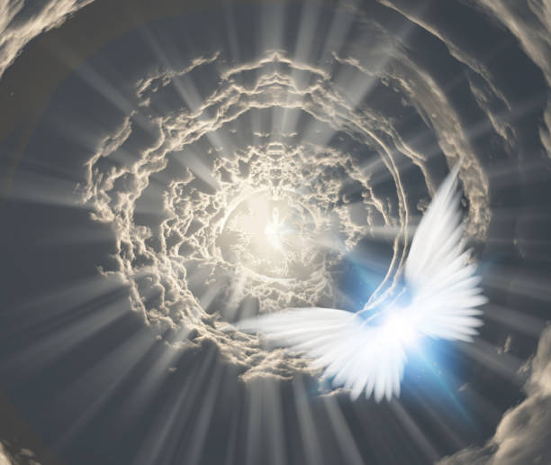 istock Angels in tunnel of clouds 1128270643