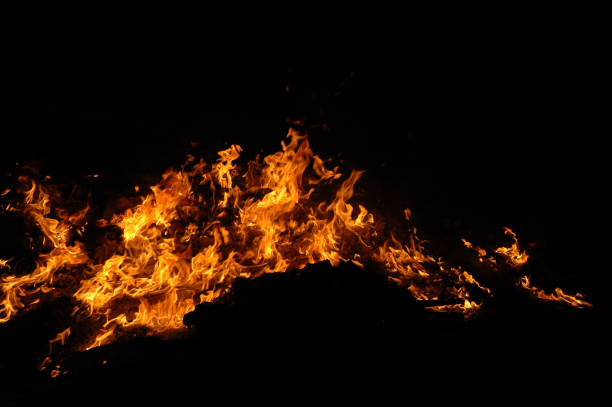 istock Glowing fire and embers against a black background 1128271984