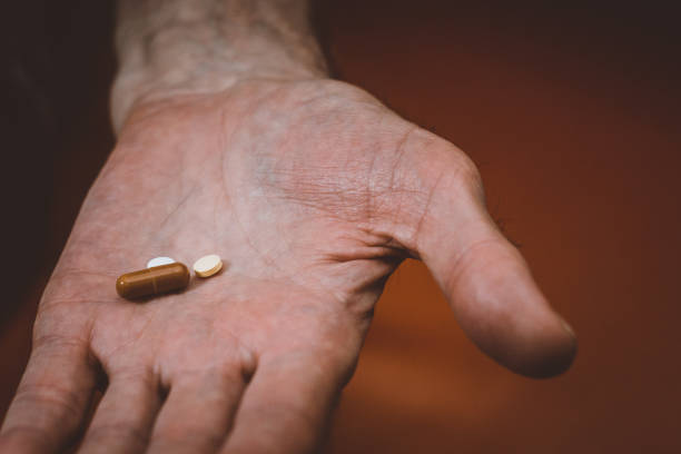 istock pills in the old hand 1128274328