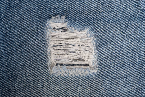 istock White stitching on blue denim jeans patch. Close up blue jean frame 1128274841