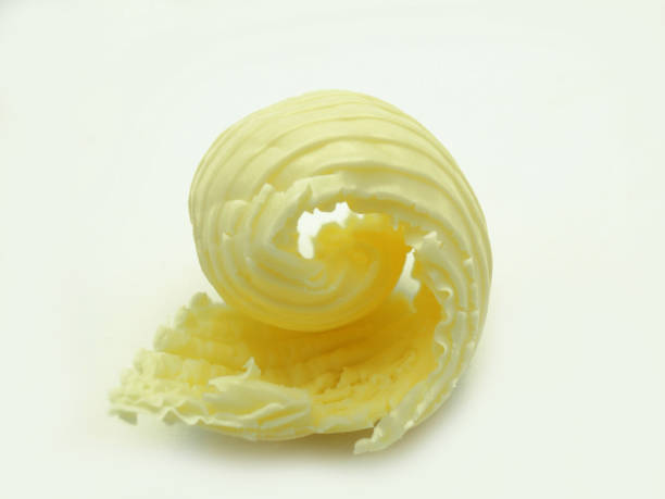 istock Roll of butter on an isolated background. 1128277189