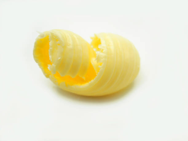 istock Roll of butter on an isolated background. 1128277217