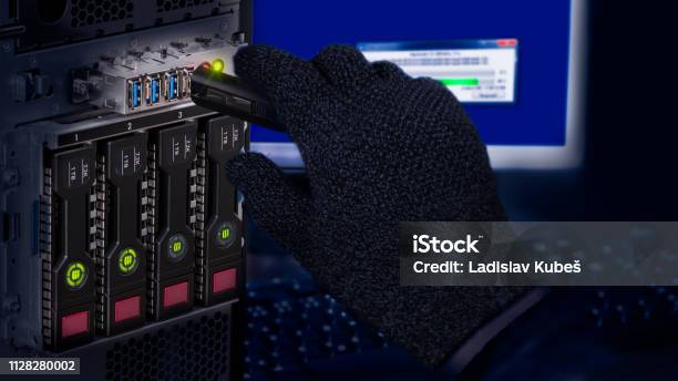 Hand In Black Glove Holding Usb Flash Drive Computer Data Theft Detail Stock Photo - Download Image Now