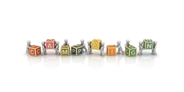 istock Business People Carrying CAMPAIGN Buzzword Cubes - 3D Rendering 1128285546