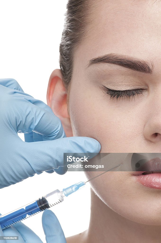 L'iniezione di botox in faccia bella donna - Foto stock royalty-free di Adolescente