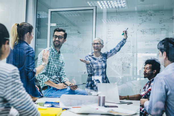 istock Happy start up team having constructive meeting and discussing about new business strategy. 1128289084