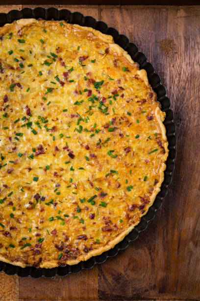 istock Traditional German onion pie with ham. Onion cake 1128289677