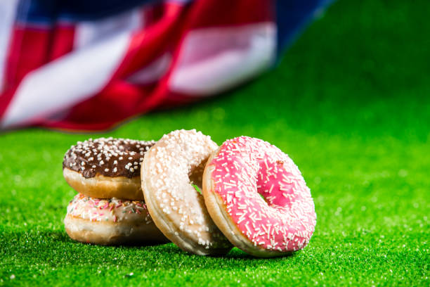 istock Sweet donuts over american waving flag 1128291403