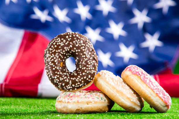 istock Sweet donuts over american waving flag 1128291412