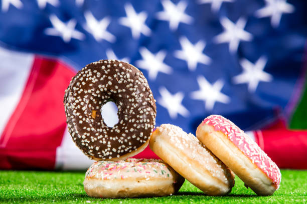 istock Sweet donuts over american waving flag 1128291417