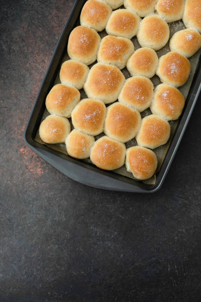 istock Top View of Baking Pan Full of Homemade Dinner Rolls 1128292055