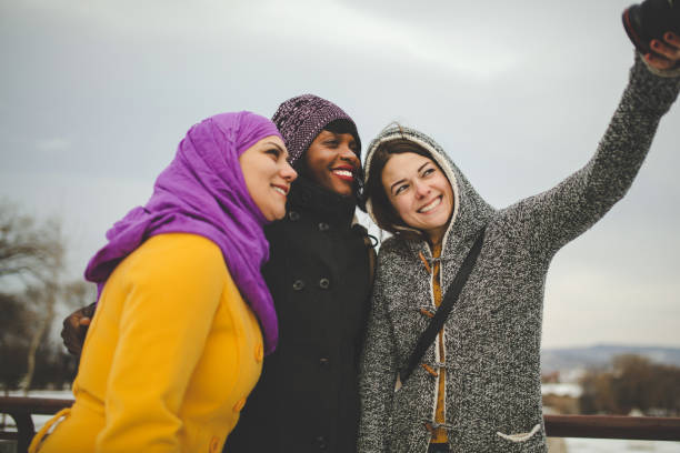 istock Friends taking selfie together 1128294568