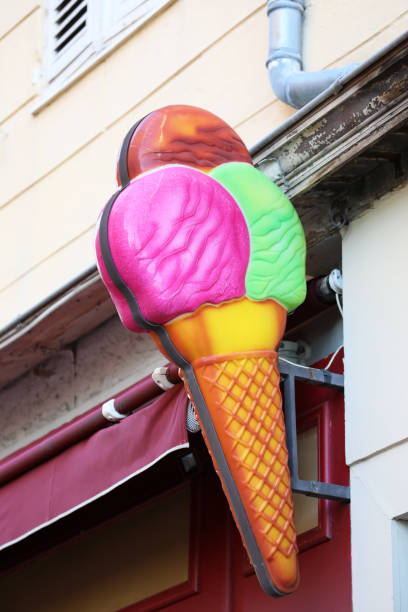 istock Fake Plastic Ice Cream Cone On The Wall 1128297246