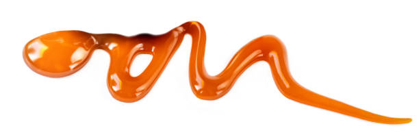 istock Caramel sauce isolated on white background 1128300067