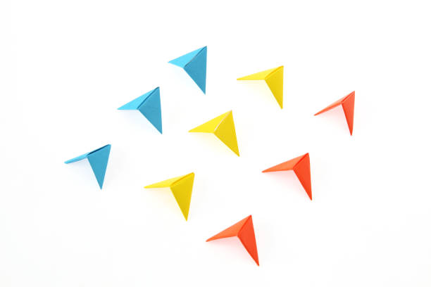 istock arrow formed origami in a white background 1128300090