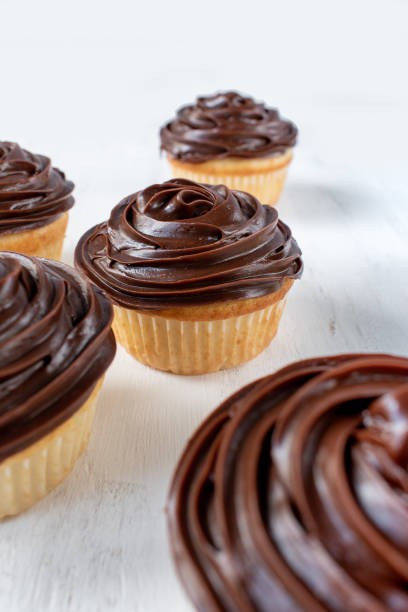 istock homemade vanilla cupcakes with chocolate swirl 1128305983