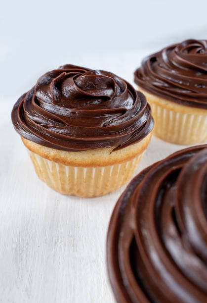 istock homemade vanilla cupcakes with chocolate swirl 1128306533