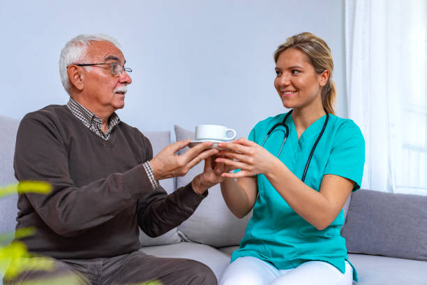 istock Health visitor and a senior man during home visit. 1128308609