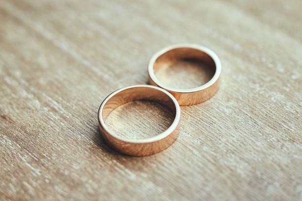 istock beautifull wedding rings lie on the table 1128312563