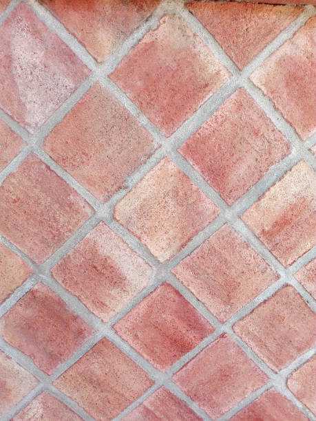 Wall of clay slabs Wall of clay slabs forming a mosaic in rhombuses capas superpuestas stock pictures, royalty-free photos & images