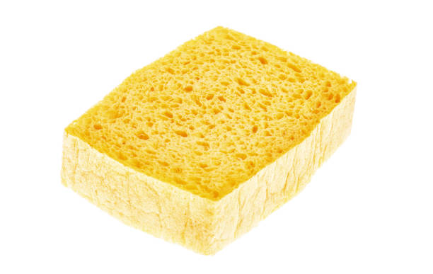 istock Yellow sponge isolated on white background. 1128312983