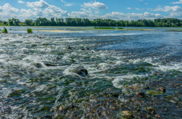 istock Magical scenery of rainforest and river with rocks. 1128317409