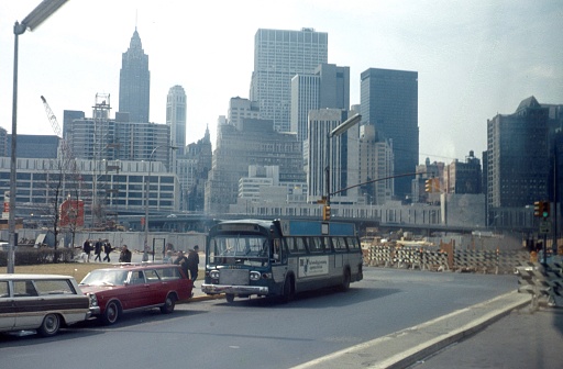 New York City, NY, USA, 1967. Street scene with buildings, pedestrians and vehicles in New York City.