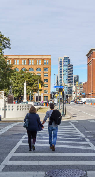 istock Mother and son walking together downtown 1128320871