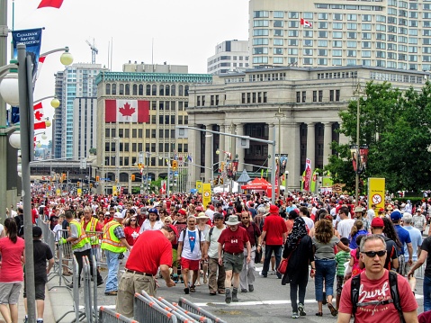 Ottawa, Ontario, Canada - July 1st, 2013: The streets of downtown Ottawa are packed with thousands of families and multicultural people celebrating Canada Day in the capital, Ottawa, Ontario, Canada.