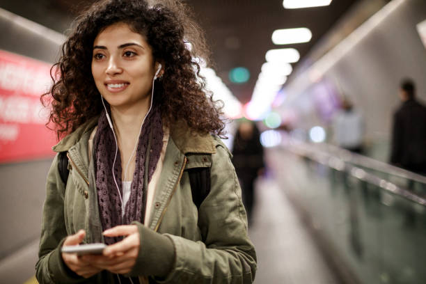 istock Young female commuter in the subway station 1128327232