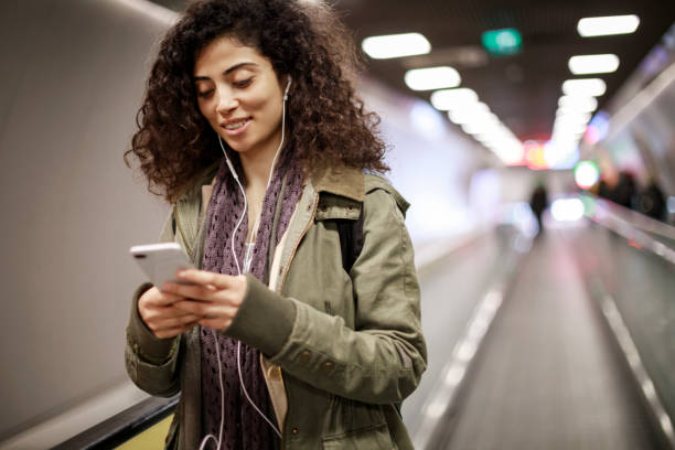 istock Young female commuter in the subway station 1128327243