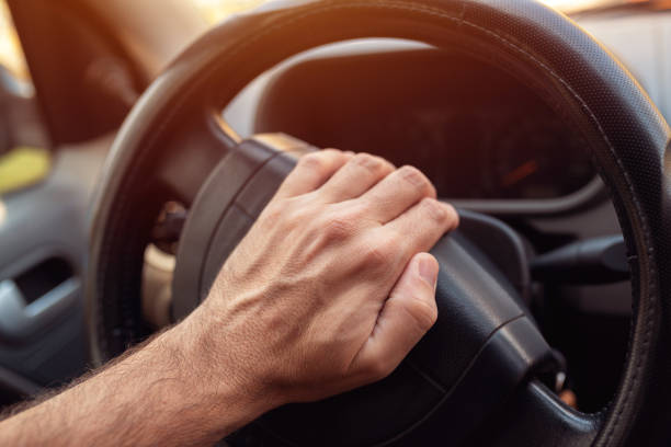 istock Nervous driver pushing car horn 1128332660