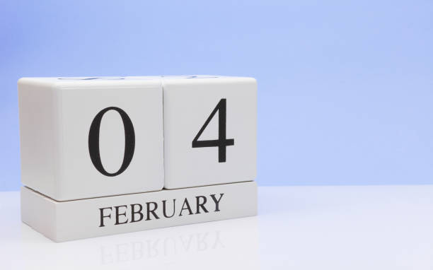istock February 04st. Day 04 of month, daily calendar on white table with reflection, with light blue background. Winter time, empty space for text 1128334746