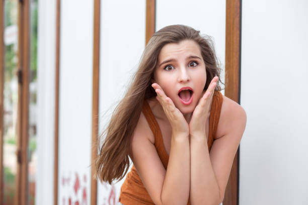 istock Amazed woman outdoors 1128335898