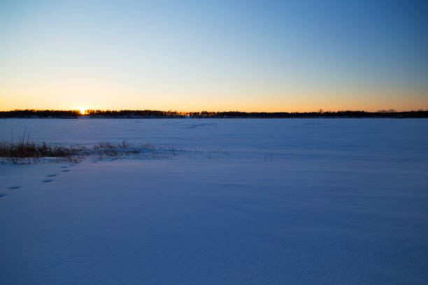 istock Sunset Over Frozen Lake 1128341473