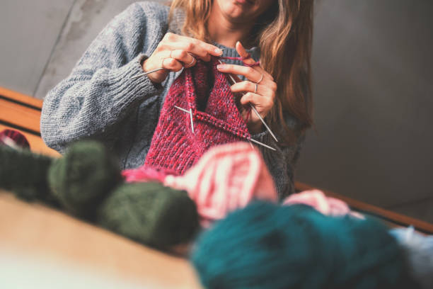 istock Close up on woman's hands knitting 1128343724