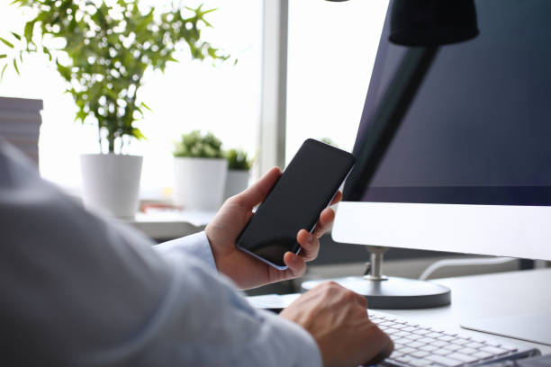 istock Businessman hipster holds telephone background of 1128343835