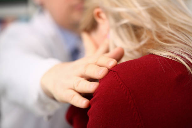 istock Young male doctor holds sick patient by hand 1128343908