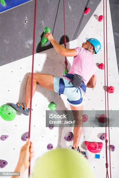 Couple Of Climbers Dressed In Rock Climbing Outfit Training Stock Photo -  Download Image Now - iStock