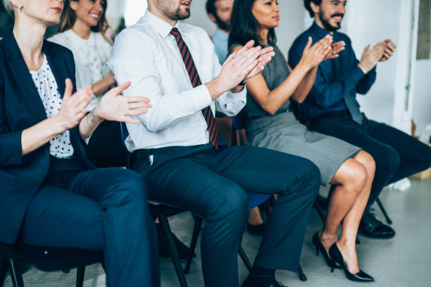 istock Audience Applauding Speaker At Business Conference 1128346088