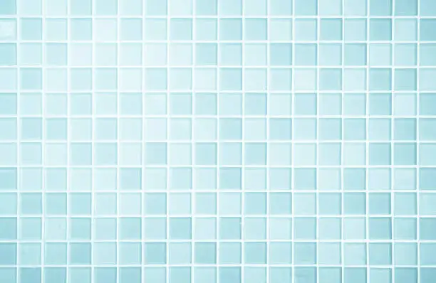 Photo of White or Blue ceramic wall and floor tiles abstract background.
