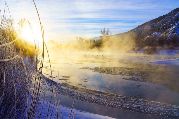 istock Sunrise and Mist During Winter on River Scenic 1128353307