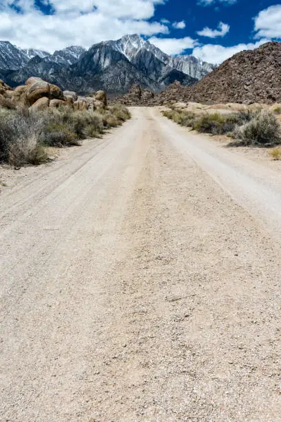 Dirt unpaved road leading through the Alabama Hills in Lone Pine California