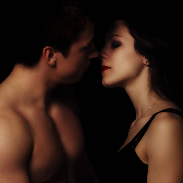 istock Young couple hugging and kissing 1128354947