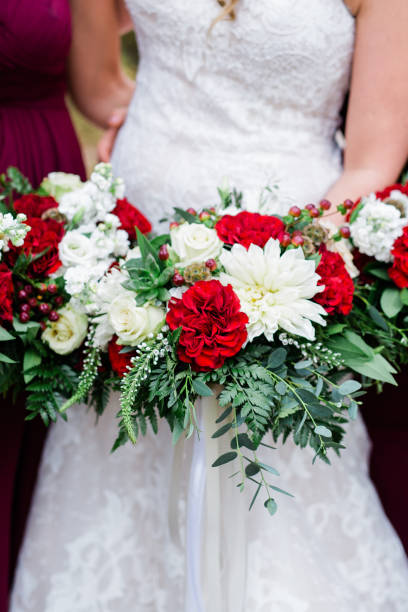 istock Bride in White Wedding Dress Holding Bouquet 1128358364