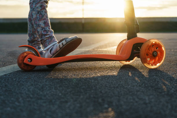 istock child's feet on a scooter 1128365746