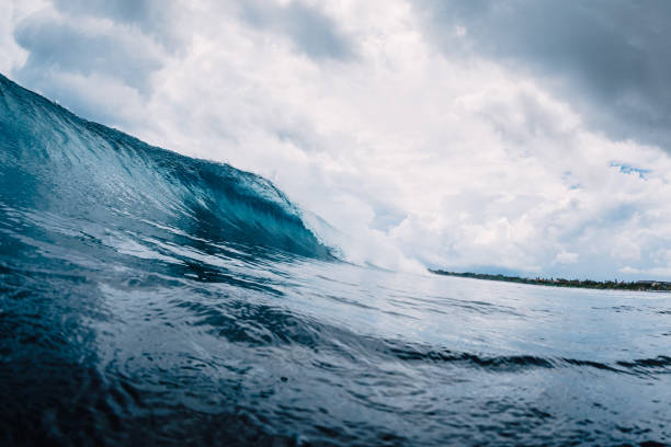 istock Blue wave in ocean. Breaking wave with blue water 1128377000