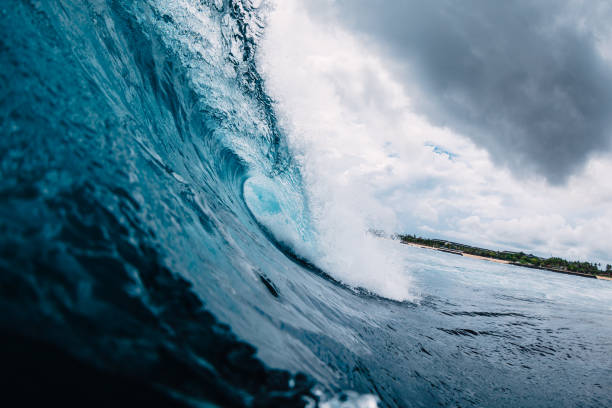 istock Blue wave in ocean. Breaking wave in tropics 1128377078
