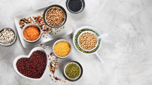 istock Assortment of colorful legumes. 1128380416