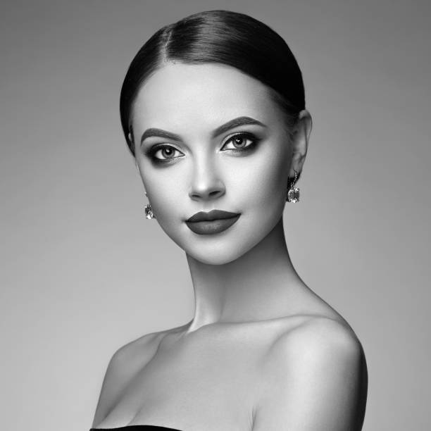 istock Beautiful woman face with perfect makeup 1128385839